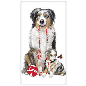 Ausie mom holding red and white striped leash. Puppy is below, looking at an orange butterfly. Red and white star ball at their feet.