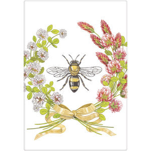 White and red budded clover in circular shape with slight opening at top. Bottom has a gold ribbon and there is a bumble bee in the center of the design.