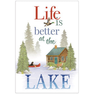 Lake setting with Black lab in red canoe surrounded by tall pine trees. Cabin and Deer on little island. Says