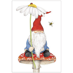 Gnome with red hat sitting on a red and white spotted toadstool mushroom. Gnome is holding a daisy with red ladybug on top and there is one bee buzzing by the gnome.