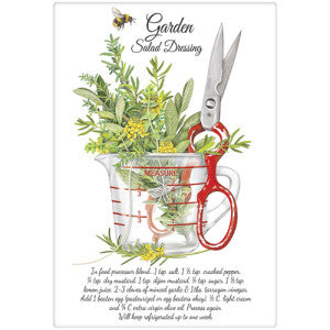 Herbs in measuring cup with red scissors, and garden salad dressing recipe. Has bee flying above and words
