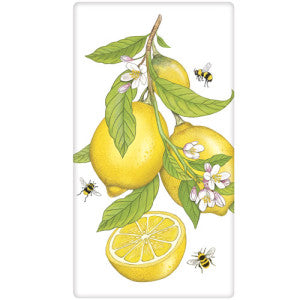 Lemons with Blooms and leaves, one lemon cut in half with bees buzzing around.