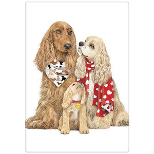 3 spaniel dogs with puppy looking up