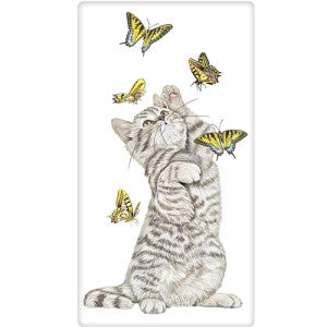 Grey and white striped kitten playing with 5 yellow butterflies that are in flight.  