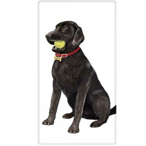 Black lab with red collar and bone tag, sitting with green tennis ball in mouth.  