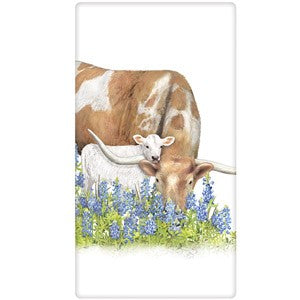 longhorn cow with calf in field of flowers