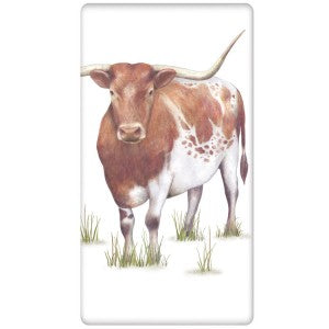 standing longhorn cow on towel