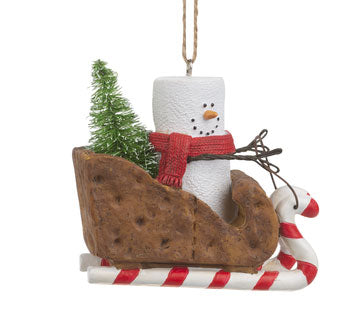 smore with scarf and tree riding in graham cracker sleigh